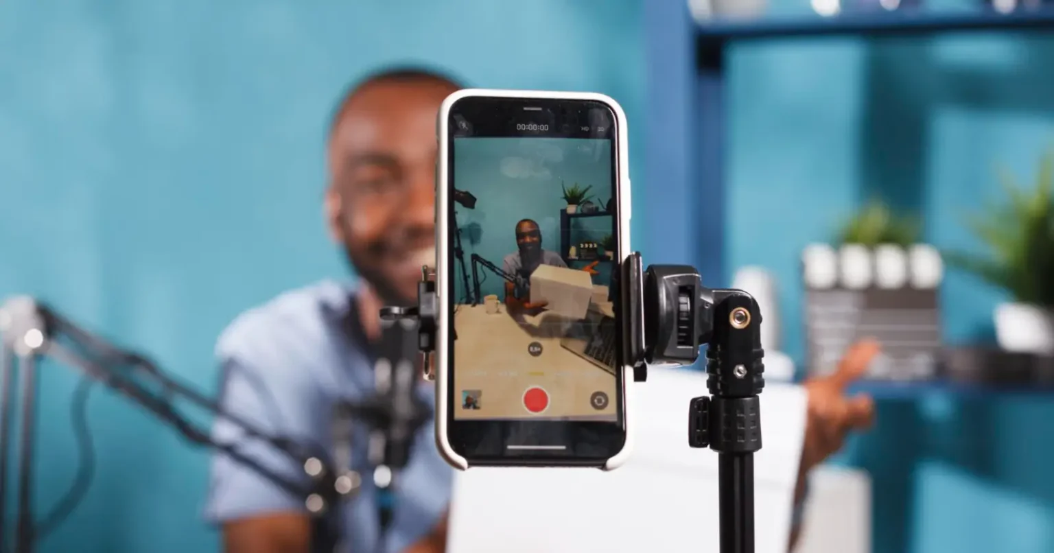 Creator showing how to go live on TikTok using a smartphone streaming setup