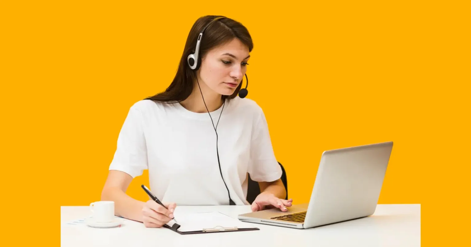Teachers Pay Teachers Explained – How Educators Buy, Sell & Earn Online Woman using a laptop and taking notes while working on online teaching resources.